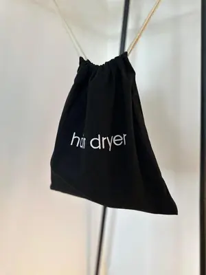 a black bag with the word hir driver on it at The Barn, Summerhill Farm Stays in Balmaclellan