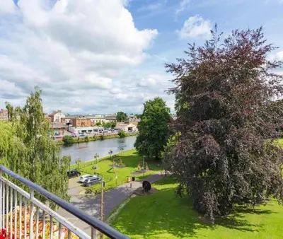 a view of a river from a balcony at Caul View Apartment in Dumfries in Dumfries