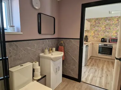 a bathroom with a white toilet and a sink at The Burrow by Blake View Holidays a peaceful boutique retreat 3 miles from Ennerdale- standard twin or super-king bed available in Rowrah