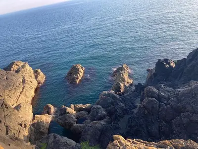 an aerial view of the ocean with rocks at Cosy Holiday Home Portpatrick in Portpatrick