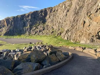 a bunch of rocks on the side of a mountain at Cosy Holiday Home Portpatrick in Portpatrick