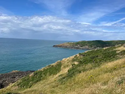 a view of the ocean from a hill at Cosy Holiday Home Portpatrick in Portpatrick