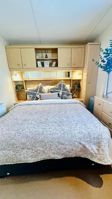 a bedroom with a large bed in a room at Shoreline Stay in Port Carlisle