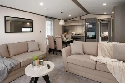 a living room with a couch and a table at Crofthead Holiday Park in Ayr
