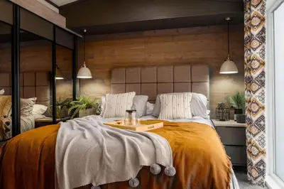 a bedroom with a large bed with a tray on it at Crofthead Holiday Park in Ayr