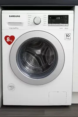 a white washing machine with its door open at 5BR House w Garden Near Stadium in Moffat