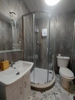 a bathroom with a shower and a toilet and a sink at Hotel Room in Maybole for Work Travel & Leisure in Maybole