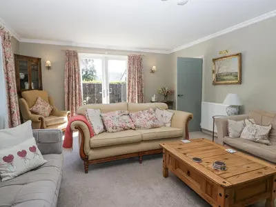 a living room with a couch and a coffee table at Osprey Cottage in Ambleside