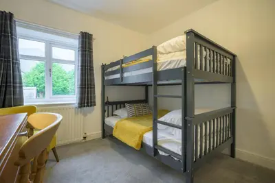 a bedroom with two bunk beds in a room at Moss Crag in Penrith
