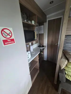 a small room with a bed and a no smoking sign at The View in Ballantrae