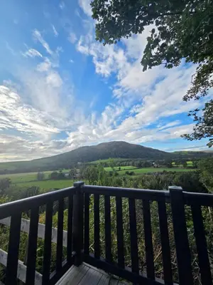 a view from the deck of a house overlooking the hills at The View in Ballantrae