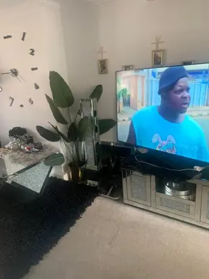 a flat screen tv sitting in a living room at Dmoney Ltd in Moffat