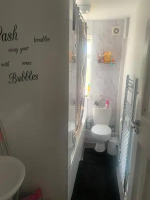 a bathroom with a toilet and a sink at Dmoney Ltd in Moffat