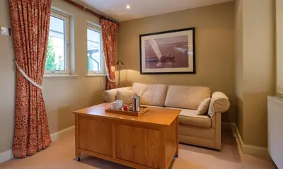 a living room with a couch and a coffee table at Robinson in Keswick