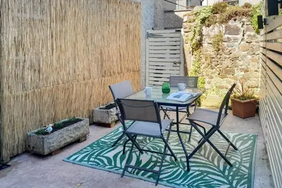 a table and chairs sitting on a patio at 2 Bed in Allonby oc-i30743 in Allonby