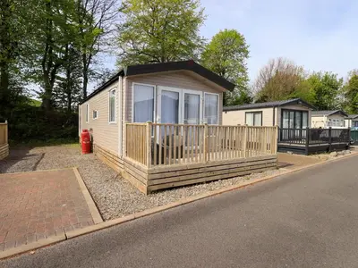 a tiny house sitting on the side of a road at Seren in Cockermouth