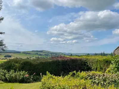 a view of the countryside from a garden at Glencairn Cottage in Moffat
