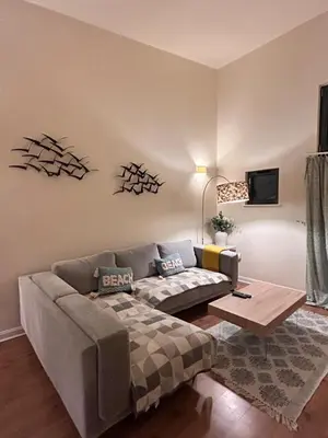a living room with a couch and a table at Marina 2bedroom Beach Nearby Swansea City in Moffat
