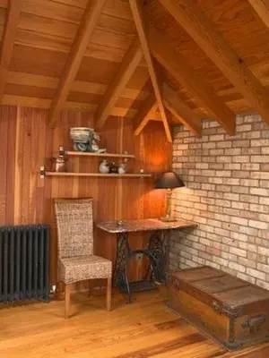 a room with a desk and a chair and a table at Lighthouse Studio Apartment in Portpatrick