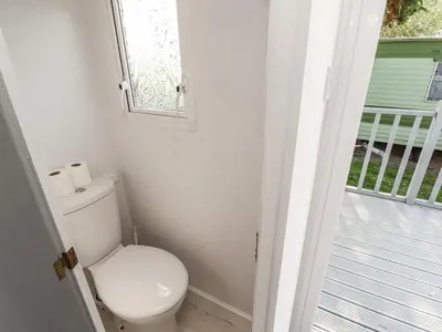 a bathroom with a toilet and a window at No 29 Wyndham Hall in Cockermouth