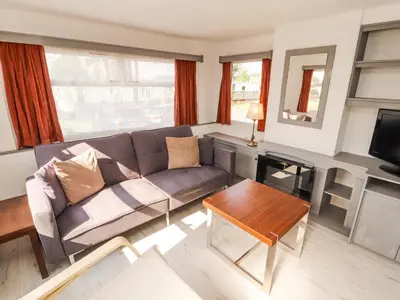 a living room with a couch and a table at No 29 Wyndham Hall in Cockermouth