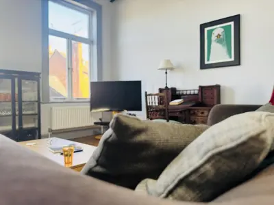 a living room with a couch and a table at High living @ Ferguson Court in Carlisle