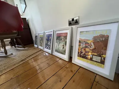 a group of framed movie posters on a wall at High living @ Ferguson Court in Carlisle