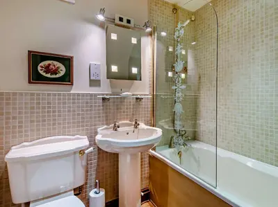 a bathroom with a sink and a toilet and a shower at 2 Bed in Ireby 96088 in Ireby