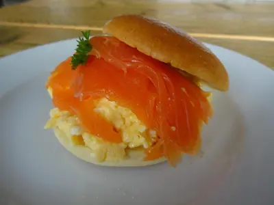 a sandwich on a white plate on a table at Lake View Country House and Self-catering Apartments in Grasmere