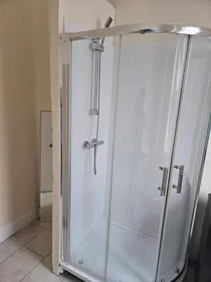 a shower with a glass door in a bathroom at Carlton road in Moffat