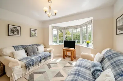 a living room with two couches and a tv at 3 Bed in Ravenglass oc-e32106 in Ravenglass