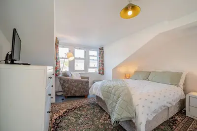a bedroom with a bed and a tv and a chair at 2 Bed in Moffat oc-a32121 in Moffat