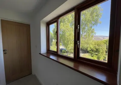 a room with a window and a door with a view at Mill House in Braithwaite