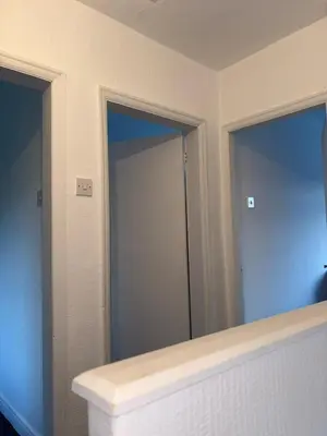 a bathroom with a mirror and a door in a room at Modern 3BR House Near Manchester-Parking Included in Moffat