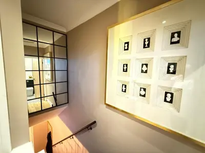 a room with a picture frame on the wall and a window at Modern House Maryport Sleeps 6 in Maryport