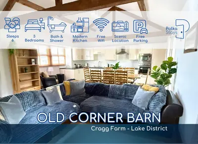 an old corner barn sign with a couch in a room at Old Corner Barn Lake District Escape by PolkaStays in Penrith