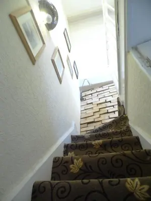a set of three stairs in a room at 2 Bedroom & 2Bathrooms in Lancaster in Moffat