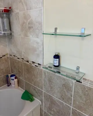 a bathroom with a tub and a sink and a shower at Single Room in Moffat