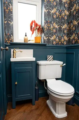 a bathroom with a toilet and a sink at Our Cosy Cottage in Gatehouse of Fleet