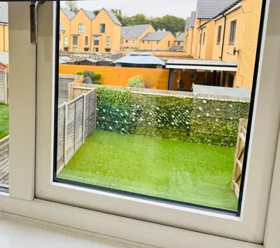 a window with a view of a yard at Middle Kent Lux! in Moffat