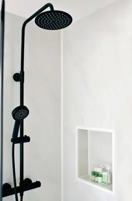 two lights in a shower with a mirror at Newly built luxury cabin in Moffat