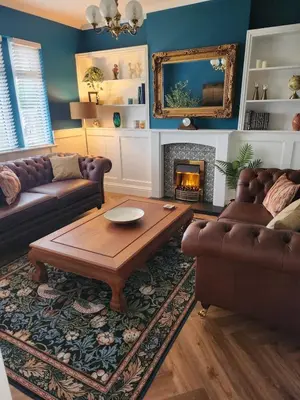 a living room with a couch and a coffee table at The Troon Hoose in Troon