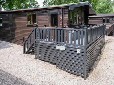 a log cabin with a porch and a porch at Watendlath in Keswick