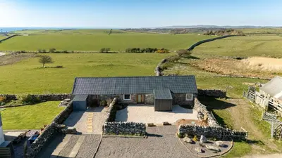 an overhead view of a house in a field at The Larroch Byre in Monreith
