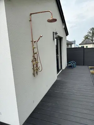 a white building with a wall with a saxophone at The Fishermans Rest in Castle Douglas