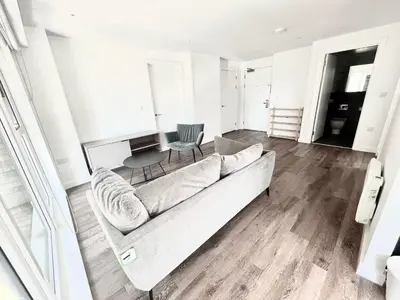 a living room with a couch and a chair at Blucher St in Moffat