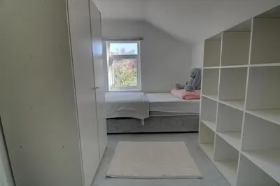 a small room with a bed and a window at Home in Reading Uni Area in Moffat