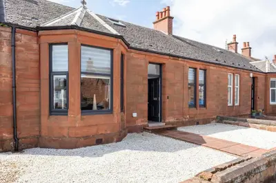 an exterior view of a brick house with large windows at No20 Mansfield - Donnini Apartments in Prestwick