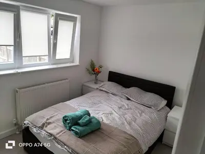 a bedroom with a bed with a stuffed animal on it at Quiet 5BR Ideal for Groups in Moffat