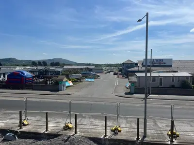 a street with a parking lot with a parking lot at Static Caravan in Moffat